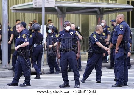 May 29, 2020 - Houston, Texas, USA: Police and spectators collide in downtown Houston, TX as rioters protest the beating and killing of George Floyd by Minneapolis police earlier in the week.