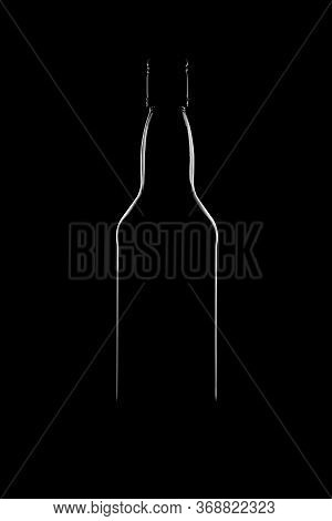 Silhouette Of A Bottle With A Beautiful Shape On A Black Background