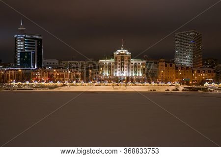 Kazan, Russia - January 3 2020:  Night Kazan. Embankment Of The Kaban Lake, View Of The Street Marce