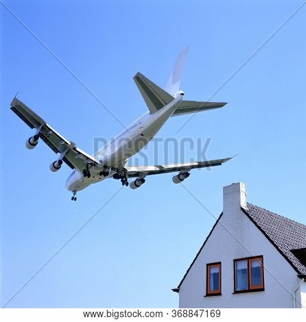 Schiphol Runway Approach By Plane Low Over Houses On Landing Approach For Amsterdam Schiphol Airpoer