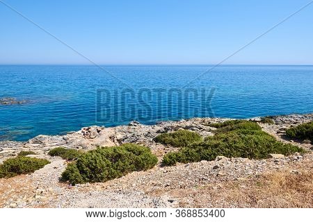 Rocky Coast With Transparent Water Near Glistra And Ladros Beach On The Island Of Rhodes