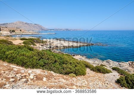 Rocky Coast With Transparent Water Near Glistra And Ladros Beach On The Island Of Rhodes