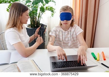 Mother Helping Teenage Daughter To Learn Touch Typing On Keyboard, Girl Is Typing With Closed Eyes W
