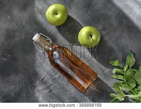 Apple Vinegar. Bottle Of Homemade Apple Organic Vinegar Or Cider On Grey Background. Healthy Organic