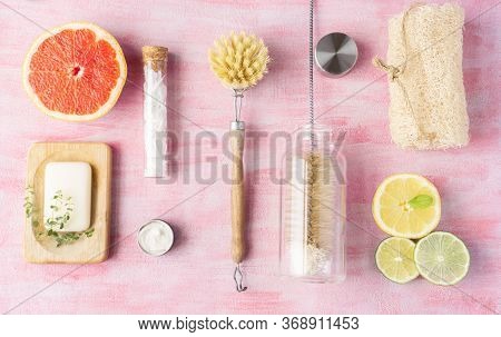 Bottle And Dish Brush, Soap, Cleaning Powder, Loofah. Some Citrus And Herbs Near. Zero Waste And Nat