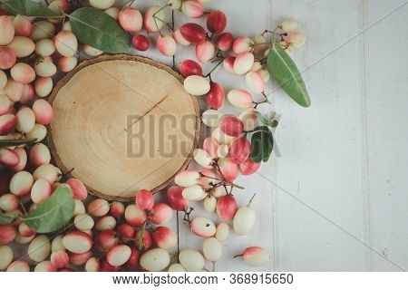 Top View Empty Of Round Wooden Tag With Fresh Carissa Carandas. Flat Lay. Carandas-plum Or Karonda F