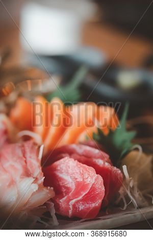 Selective Focus Of Mixed Slices Of Fresh Raw Salmon Sashimi For Dinner. Assorted Fresh Sashimi And J