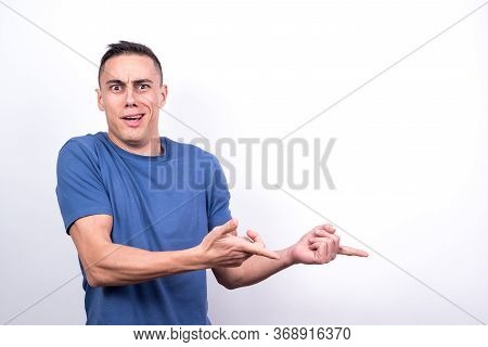 Surprised Man Pointing To Copy Space