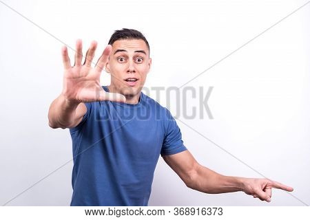 Surprised Man Pointing To Copy Space