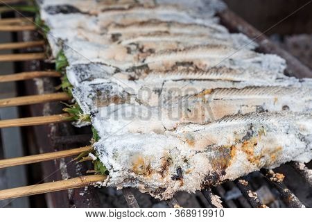 Striped Snakehead Fish Grilled With Salt. Pomegranate Fish With Salt And Then Burned For Sales In Th