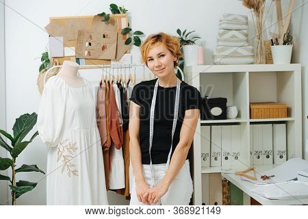 Portrait Of A Young Female Dressmaker, A Master Of Sewin