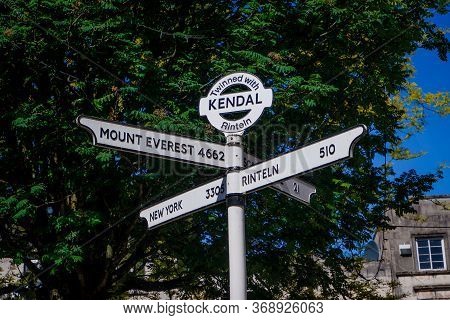 Town Signpost Showing Directions To Various Places In The Center Of Historical Town Kendal. Kendal I