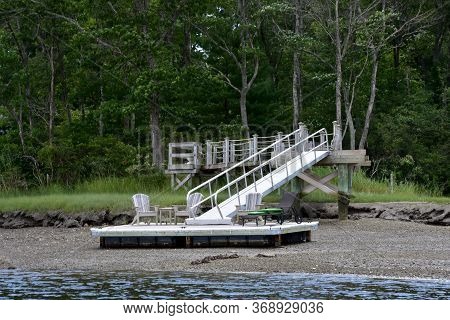 Dock At Low Tide Along The North River.