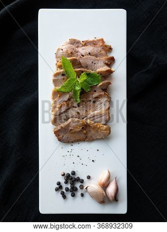 Grilled Pork,ingredients Garlic, Pepper,place On A White Plate,sprinkle With Pepper,decorate The Fac