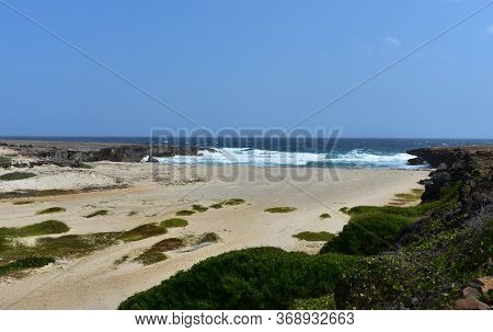 Scenic Coastal Daimari Beach On The Shore Of Aruba.
