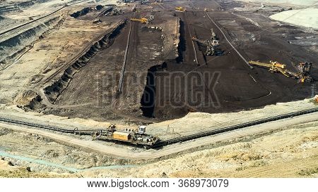 Panoramic View Of A Quarry With Huge Machine, Bucket Wheel Excavator Mining A Coal. Heavy Industry
