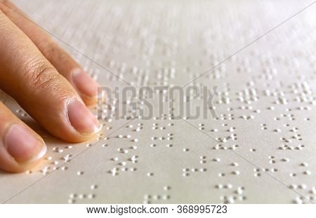 Braille Reading. Blind Woman Reads A Book In Braille