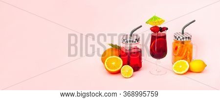 Quarantini Or Homemade Alcohol Drink And Tropical Fruit Cocktails On Pink Background. The Concept Of