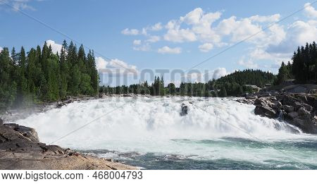 Scenic Laksforsen Waterfall At Vefsna River On European Grane Town In Nordland Region In Norway, Cle