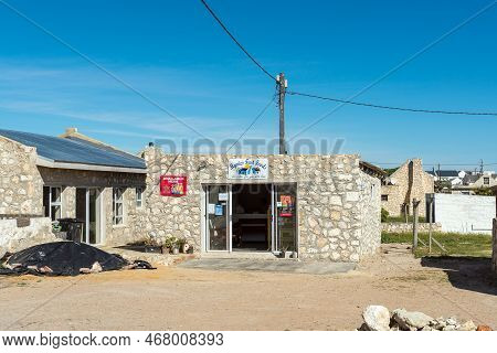 Arniston, South Africa - Sep 22, 2022: A Street Scene, With Mynies Fast Foods, In Kassiesbaai, Arnis