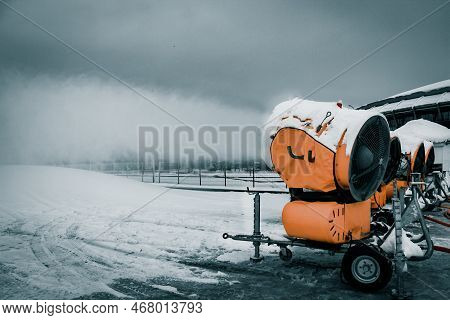Snow Cannons Spray Artificial Snow Crystals. Production Of Artificial Snow. Cars Make Snow. Snow Gun