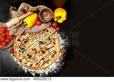 Delicious Italian Pizza With Mushrooms And Melted Cheese On A Black Table Surrounded By Cherry Tomat