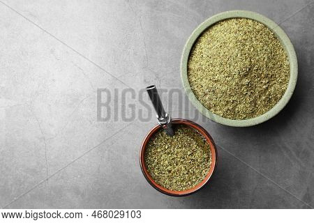 Guampa With Bombilla And Bowl Of Mate Tea Leaves On Grey Table, Flat Lay. Space For Text