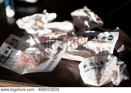 Sioux Falls, South Dakota, Usa - 11.2022 - Pile Of Wadded Up And Crumpled Losing Powerball Lottery T