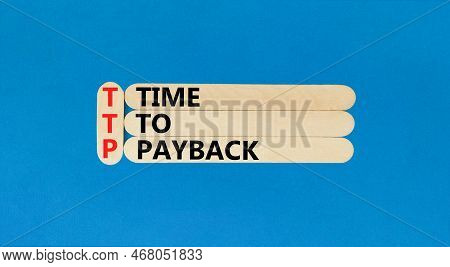 Ttp Time To Payback Symbol. Concept Words Ttp Time To Payback On Wooden Sticks On Beautiful Blue Tab