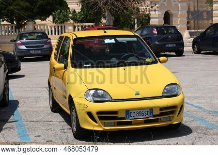 Salento, Italy - June 2, 2017: Fiat Seicento Small Yellow Beater Car Parked In Italy. There Are 41 M