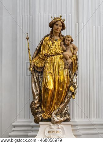 Solothurn, Switzerland - July12, 2022: Gilded Statue Of Mary, Queen Of Peace, With Child Jesus In Th