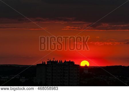 Sunset On Ostrowiec Swietokrzyski. An Intense Red Sky. The Setting Sun Beautifully Illuminates The C