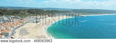 Nazare, Portugal - August 16, 2022: Aerial View Of The Praia De Nazare,nazare Beach, And The City Of