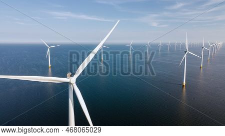 Wind Turbine From Aerial View, Drone View At Windpark Westermeerdijk A Windmill Farm In The Lake Ijs