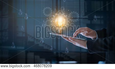 Abstract Of Technology And Innovation, Creativity And Inspiration, Businessman Using Tablet With Lig