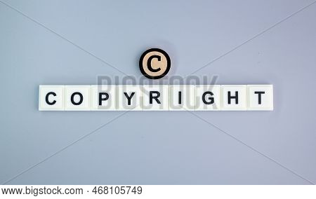 Alphabet Letters Of The Word Copyright With The Letter C Above. Concept Of Ownership. The Concept Of