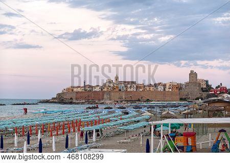 Panoramic View Of The Old Town Of Termoli With Beach Umbrellas, The Colorful Houses And Svevo Castle