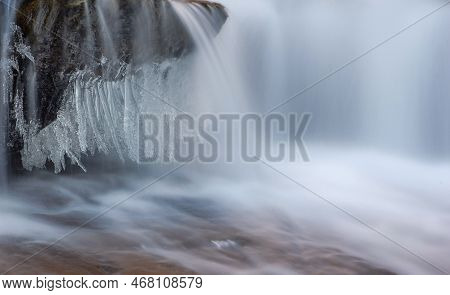 Frozen Waterfall. Mountain Water Cascades Covered With Ice
