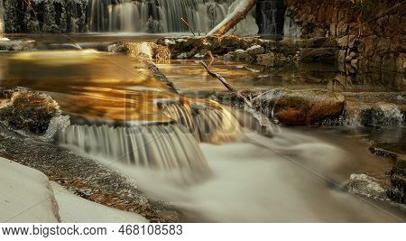 Frozen Waterfall. Mountain Water Cascades Covered With Ice