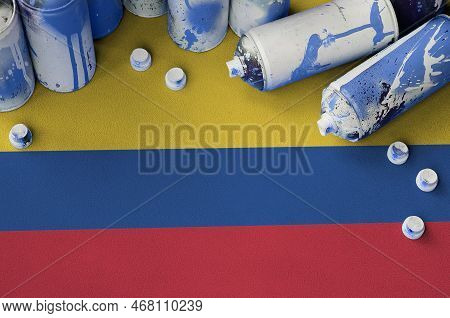 Colombia Flag And Few Used Aerosol Spray Cans For Graffiti Painting. Street Art Culture Concept, Van