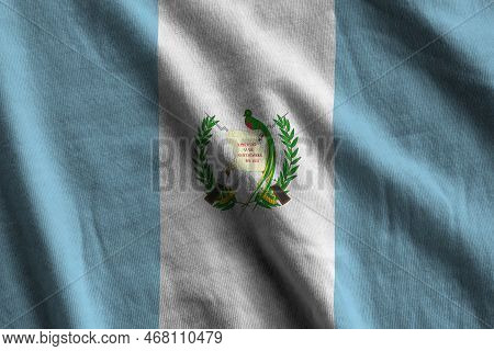 Guatemala Flag With Big Folds Waving Close Up Under The Studio Light Indoors. The Official Symbols A