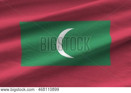 Maldives Flag With Big Folds Waving Close Up Under The Studio Light Indoors. The Official Symbols An