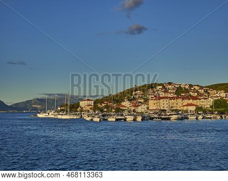 Trogir, Croatia - 06 24 2015: Harbor And City Center At Sunset Dring Golden Hour With Boats And Yach