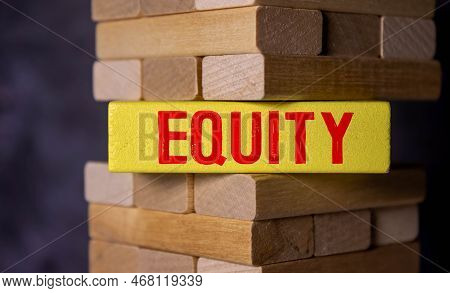 A Picture Of Wooden Block With Equity Word, House Miniature And Fake Money Insight. Equity Is The Di