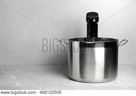 Sous Vide Cooker In Pot On Light Grey Table, Space For Text. Thermal Immersion Circulator