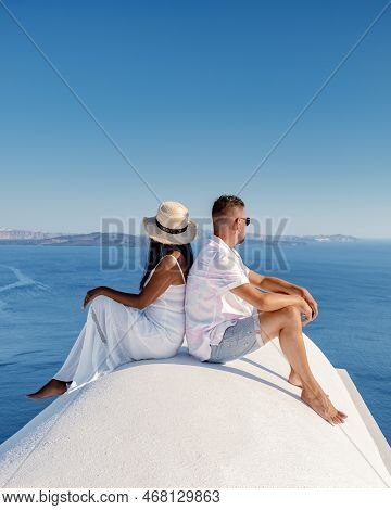 Couple Of Men And Women On Vacation In Santorini Greece, Couple Visit Oia Santorini