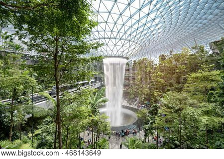 Changi, Singapore - 26/12/2022 : Jewel Changi Airport , Artificial Waterfall Dome With Plants Where