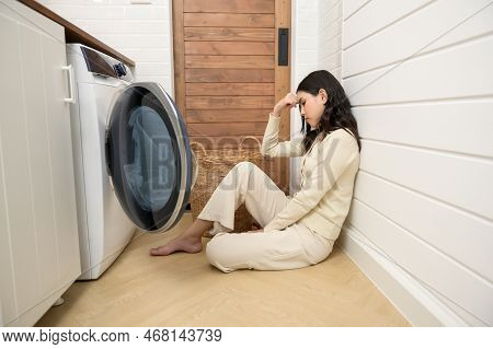 Exhausted  Asian Young Woman With Dirty Clothes , Doing Laundry In Home