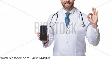 Medical Man Crop View. Telehealth Doctor Holding Smartphone Showing Ok. Medical Practitioner