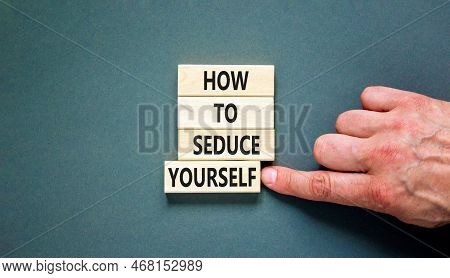 How To Seduce Yourself Symbol. Concept Word How To Seduce Yourself On Wooden Blocks. Businessman Han